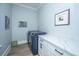 Functional laundry room with modern washer and dryer, ample counter space and natural light at 3635 Pandora Dr, Mount Pleasant, SC 29466