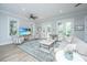 Bright living room features a ceiling fan, area rug, comfortable seating, and French doors to the outside at 3635 Pandora Dr, Mount Pleasant, SC 29466