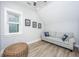 Bright living room featuring a comfortable sofa, ottoman, and plenty of natural light at 3635 Pandora Dr, Mount Pleasant, SC 29466