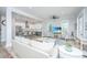 Open concept living room flows into a bright kitchen with bar seating and stainless steel appliances at 3635 Pandora Dr, Mount Pleasant, SC 29466