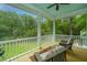 Relaxing screened porch with comfortable seating offers a peaceful retreat overlooking the lush greenery at 3635 Pandora Dr, Mount Pleasant, SC 29466