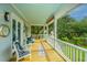 Stylish porch with outdoor seating offering a pleasant view of the landscaped yard at 3635 Pandora Dr, Mount Pleasant, SC 29466