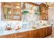 Luxurious bar area featuring marble countertops, custom cabinetry, and elegant gold accents at 3688 Goodwater St, Mount Pleasant, SC 29466
