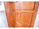 Close-up of the wooden cabinets of the custom bar area, designed with sleek, modern hardware at 3688 Goodwater St, Mount Pleasant, SC 29466
