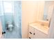 Bright bathroom with bead-board wainscoting, a white vanity, and a shower/tub combo with shower curtain at 3688 Goodwater St, Mount Pleasant, SC 29466