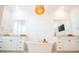 Bright bathroom featuring double vanities, soaking tub, white marble floors and modern fixtures at 3688 Goodwater St, Mount Pleasant, SC 29466