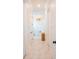 Hallway view of a luxurious bathroom with a soaking tub and marble floors at 3688 Goodwater St, Mount Pleasant, SC 29466