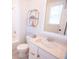 Bright bathroom featuring a white sink with white marble countertop, a toilet, and a bath at 3688 Goodwater St, Mount Pleasant, SC 29466