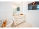 Vanity and soaking tub in a well-lit bathroom at 3688 Goodwater St, Mount Pleasant, SC 29466