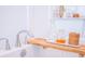 Modern tub with a wooden tray holding bath essentials at 3688 Goodwater St, Mount Pleasant, SC 29466