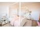 Bright bedroom with a canopy bed, pink accents, and hardwood floors with an area rug at 3688 Goodwater St, Mount Pleasant, SC 29466