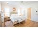 Airy bedroom with wood floors, upholstered headboard, and bright natural light at 3688 Goodwater St, Mount Pleasant, SC 29466