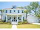 Charming two-story home with light blue shutters, inviting front porch, and well-manicured lawn at 3688 Goodwater St, Mount Pleasant, SC 29466