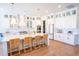 Bright eat-in kitchen with a large island, pendant lights, and white cabinets at 3688 Goodwater St, Mount Pleasant, SC 29466