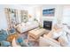 Comfortable living room with fireplace, bookshelves, and plush seating at 3688 Goodwater St, Mount Pleasant, SC 29466