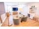 Second floor living room featuring hardwood floors, a television, and a sofa bed, with shelving at 3688 Goodwater St, Mount Pleasant, SC 29466