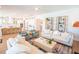 Open concept living room flows into the kitchen, creating an airy and inviting space at 3688 Goodwater St, Mount Pleasant, SC 29466