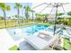 Beautiful backyard pool and spa, complete with lounge chairs, umbrellas, and lush landscaping at 3688 Goodwater St, Mount Pleasant, SC 29466
