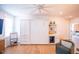 Sofa bed featuring shelving, a mini fridge, cabinets, and overhead ceiling fan at 3688 Goodwater St, Mount Pleasant, SC 29466