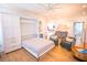 Second floor sofa bed is down, with hardwood floors, seating, shelving and cabinets, and overhead ceiling fan at 3688 Goodwater St, Mount Pleasant, SC 29466