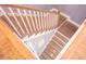 Close up of the house stairs, featuring light wood steps and white railings, accented by pale blue walls at 3688 Goodwater St, Mount Pleasant, SC 29466