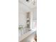Bright bathroom featuring a tub with white subway tile surround and convenient built-in shelving for storage at 4 Catfiddle St, Charleston, SC 29403