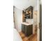 Bedroom wet bar featuring a grey cabinet with open shelving, a sink, and views through french doors at 4 Catfiddle St, Charleston, SC 29403