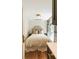 Cozy bedroom featuring a comfortable bed, soft lighting, and an inviting atmosphere, with french doors leading to the outside at 4 Catfiddle St, Charleston, SC 29403