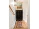 Hallway with wooden stairs, a decorative dresser, and a stylish rug, adding character to the home's interior at 4 Catfiddle St, Charleston, SC 29403