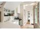 Bright white kitchen featuring an olive green gas range, farmhouse sink and wood floors at 4 Catfiddle St, Charleston, SC 29403