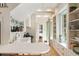 Bright kitchen with a marble countertop, open shelving, and a view into a serene bedroom space, blending style and functionality at 4 Catfiddle St, Charleston, SC 29403