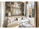 Comfortable living area with scenic artwork, natural light, and stylish ottoman at 4 Catfiddle St, Charleston, SC 29403