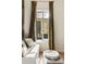 Bright living room features drapes, comfortable seating, and sunlit window at 4 Catfiddle St, Charleston, SC 29403