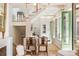 Open-concept living space with modern furnishings, a staircase, and stylish decor offering a bright and airy ambiance at 4 Catfiddle St, Charleston, SC 29403