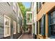 Picturesque street view of colorful homes with shuttered windows and balcony at 4 Catfiddle St, Charleston, SC 29403