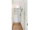 Organized walk-in closet with white shelving and drawers, providing ample storage for clothing and accessories at 4 Catfiddle St, Charleston, SC 29403