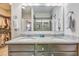 Modern bathroom featuring granite countertops, double sinks, a large mirror, and a glass-enclosed shower at 404 Snowy Plover Ln, Summerville, SC 29486