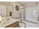 Cozy bathroom with tub-shower combo, vanity with sink, and decorative Soap Co. sign at 404 Snowy Plover Ln, Summerville, SC 29486