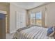 Bright bedroom featuring a comfortable bed, large windows, and minimalist decor for a serene atmosphere at 404 Snowy Plover Ln, Summerville, SC 29486