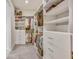 Bright walk-in closet featuring custom shelving and drawers to maximize storage space at 404 Snowy Plover Ln, Summerville, SC 29486