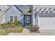 Close up front door view with landscaping and visible house number at 404 Snowy Plover Ln, Summerville, SC 29486