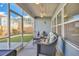 Relaxing screened-in porch with comfortable seating and outdoor views, ideal for enjoying the weather at 404 Snowy Plover Ln, Summerville, SC 29486