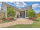 A brick path leading to a patio and screened-in porch overlooks the backyard at 405 Decatur Dr, Summerville, SC 29486