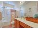Cozy bathroom with vanity, tub, shower and ample natural light at 405 Decatur Dr, Summerville, SC 29486