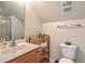 Bathroom with wooden shelving, a tiled floor, and a sink with silver faucet and hardware at 405 Decatur Dr, Summerville, SC 29486