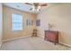 Neutral bedroom featuring a ceiling fan, window with blinds and wooden dresser at 405 Decatur Dr, Summerville, SC 29486