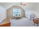 This bedroom features neutral carpet, a window, a ceiling fan, and two doorways at 405 Decatur Dr, Summerville, SC 29486