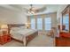 Serene bedroom with plush carpeting, ceiling fan, and large windows providing natural light at 405 Decatur Dr, Summerville, SC 29486
