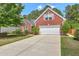 Charming two-story brick home featuring a two-car garage and well-manicured front lawn at 405 Decatur Dr, Summerville, SC 29486