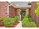 Charming entryway with brick siding, lush landscaping, and a welcoming front door at 405 Decatur Dr, Summerville, SC 29486